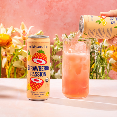 A can of Strawberry Passion being poured into a glass.